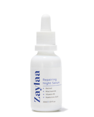 a white bottle of Zaylaa Repairing Night Serum with a dropper on a white background.